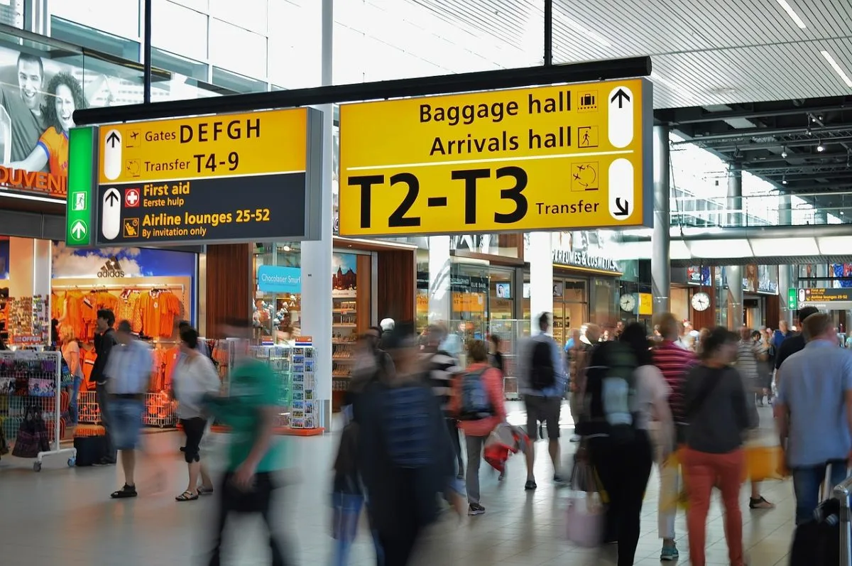 a group of people walking in a terminal