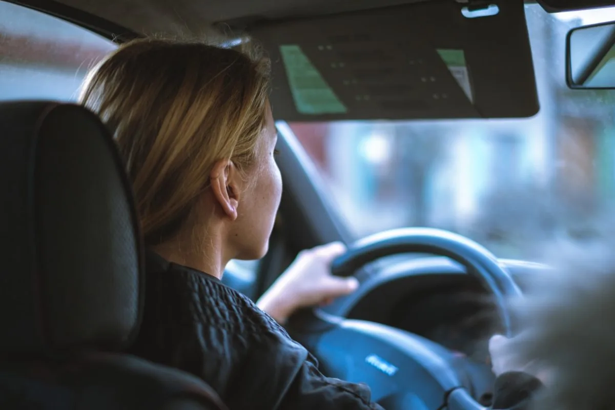 a woman driving a car